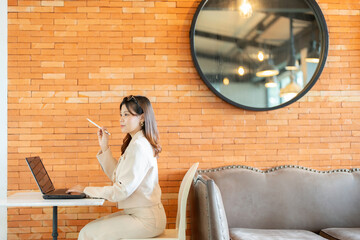 The female executive’s office setup featured her laptop as an essential tool for navigating...