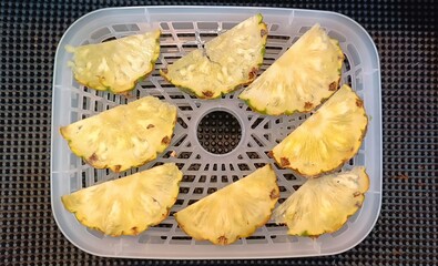 Pineapple sliced on tray for make dried fruit