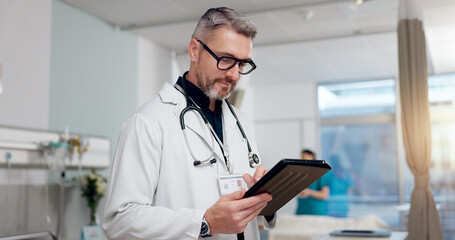 Medical, doctor and typing on tablet at clinic for Telehealth consultation, healthcare charts and health records. Man, digital and surgery schedule, prescription information and treatment compliance