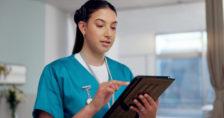 Nurse, healthcare and reading on tablet at hospital for Telehealth consultation, medical charts and wellness. Female person, digital and medicine research, review information and diagnosis results