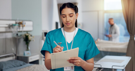 Nurse, woman and writing in folder, hospital or clinic for recovery, wellness or healthcare for...