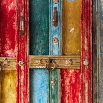 India, State of Gujarat, Bhuj, Meghwal. Bhirandiara. Painted door abstract.