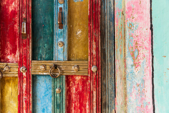 India, State of Gujarat, Bhuj, Meghwal. Bhirandiara. Painted door abstract.