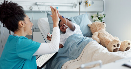 Child, pediatrician and high five in hospital or clinic with playful, wellness and healthcare for...
