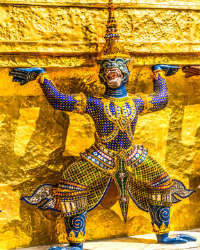 Colorful guardians statue gold stupa pagoda, Grand Palace, Bangkok, Thailand. Palace was a complex of buildings and home of King of Thailand from 1782 to 1925