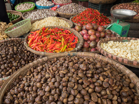Vietnam, Hanoi, Old Quarter. Nuts, peppers, and other foods for sale.