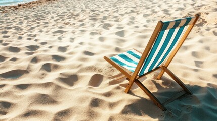 Obraz premium Relaxing Beach Chair on Sunny Sand