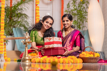 Diwali festival background, Diwali concept image,2025 Diwali celebration background, two girls dressed in traditional clothes, they make colourful arrangements with flowers as they celebrate Diwali.