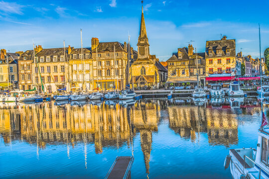 Colorful marina, Inner Harbor, Honfleur, France. Honfleur is famous for its reflections, which inspired Monet