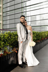 A beautiful couple in love against the backdrop of a Ferris wheel. The bride and groom