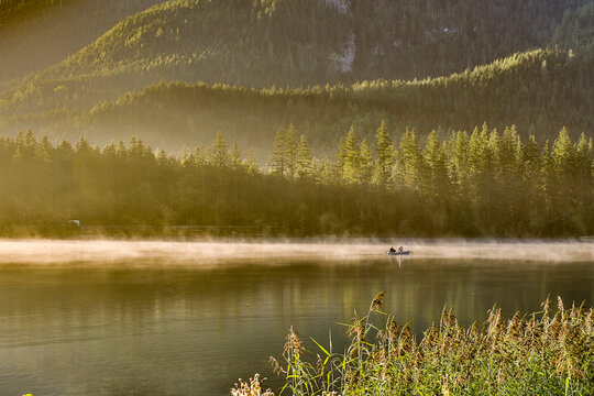 Europe, Germany, Bavaria, Ramsau bei Berchtesgaden, Fishing on Lake Hintersee in Early Morning Light