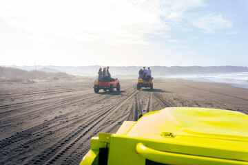 Outback relaxing adventure with point of view 4WD vehicle jeep at the beach of an ocean at sunrise. Travelling with family and adventure togehter © Tito Rollis
