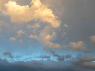 dramatic rain clouds over the blue sky