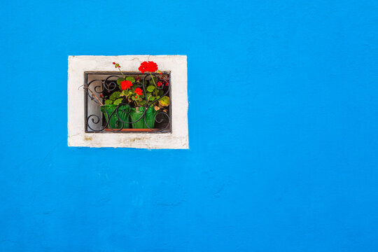 Europe, Italy, Burano. Window of colorful house. 