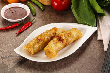 Vietnamese stuffed spring roll served sauce