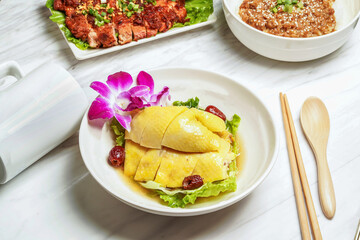 Huadiao poached chicken, pork chop, minced pork rice served in dish isolated on marble background side view of taiwan food