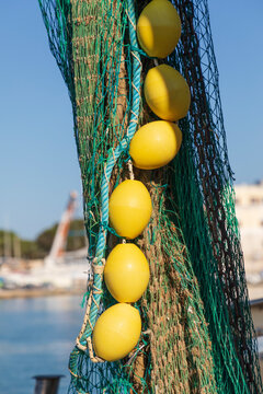 Italy, Apulia, Province of Barletta-Andria-Trani, Trani. Close-up of fishing net and floats.
