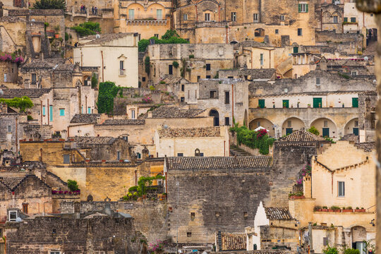 Italy, Basilicata, Province of Matera, Matera. Old stone buildings on a steep hillside.