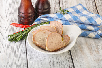 Baked pork tenderloin served rosemary