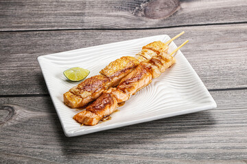 Grilled salmon skewer with sauce
