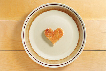 Heart-shaped piece of toasted bread