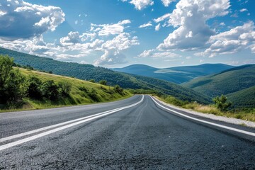 Naklejka premium Road with hills and sky as backdrop