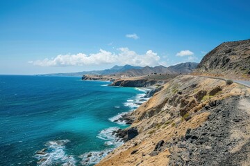 Rocky coast and sandy shoreline with blue sea