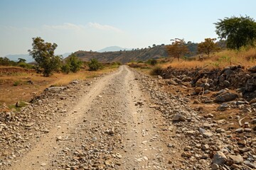Rough valley road with rocky soil in summer heat Unsuitable for transportation