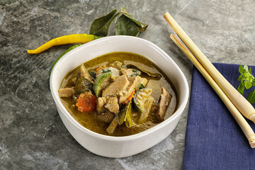 Thai green curry soup with basil