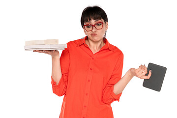 Woman in Orange Shirt Weighs Books and Tablet With Puzzled Expression in  Bright Studio