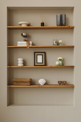 Shelves with blank photo frame mock up, vases and assorted ornaments.
