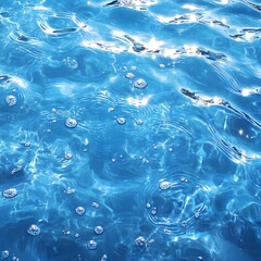 There is a blue water surface with ripples and bubbles