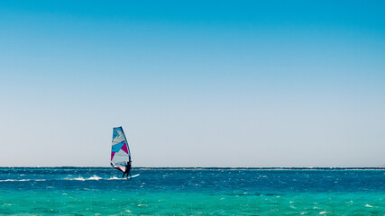 one surfer rides in the Red Sea in Egyp
