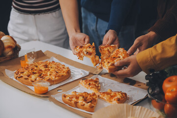 Group of young friends eating pizza.Home party.