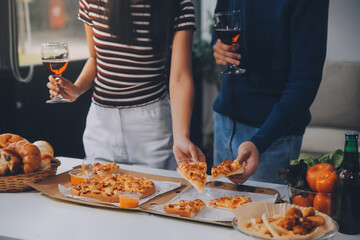 Group of young friends eating pizza.Home party.