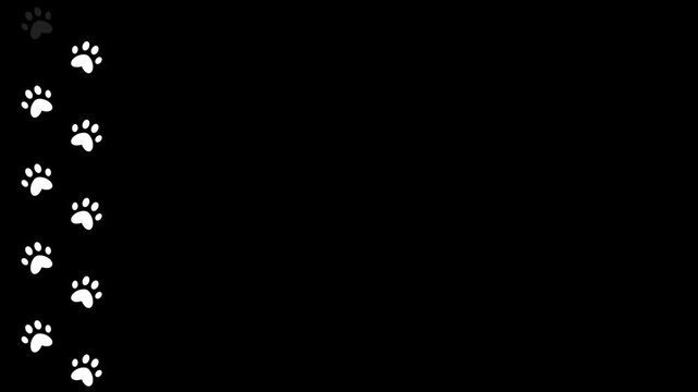 White pet paw prints on black background along the screen. Paw prints of a walking animal along the path of movement. White silhouettes of dog tracks