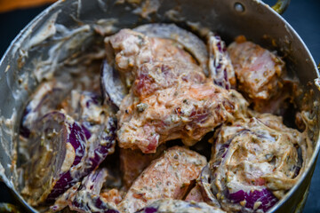 Meat marinating for the shashlik (or shish kebab) in mayonnaise, with onion