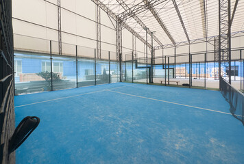 Padel court with lines and net indoor