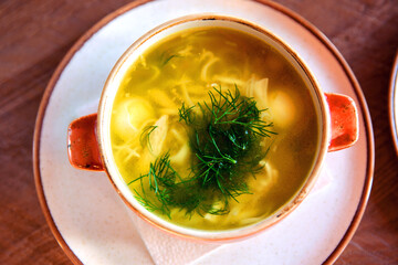 Traditional noodle and potato soup seasoned with dill