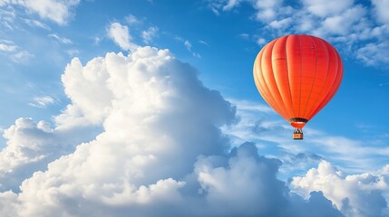 Fototapeta premium Hot Air balloon in between the clouds on a sunny day, close-up. Hot air balloon in the clouds, fabulous picture. copy space for text.