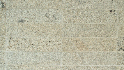 Detail of the texture of a mosaic of a grey-coloured stone paving stone floor.