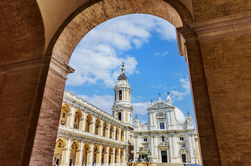 Stunning architecture of the Basilica of the Holy House in Loreto under a bright blue sky. Loreto,...