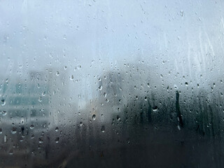 misted glass with droplets of water draining down