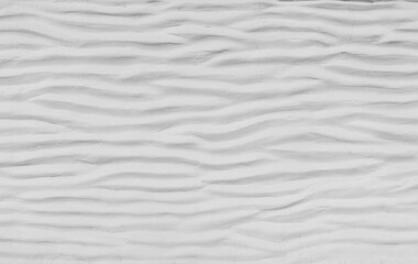 White cement wall curved with wave pattern. Modern design of white wavy background