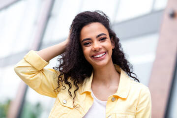 Photo of nice pretty young girl smile touch hair pastime fresh air street outdoors