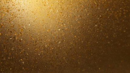 This image showcases golden bubbles on a textured background, creating an abstract design filled with joy, creativity, and warmth.