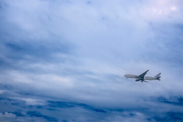 In the evening, an airplane takes off