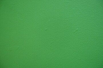 Macro of bright may green painted wall