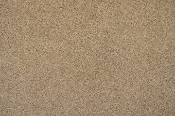 Close shot of coarse beige and pink pebble dash finish