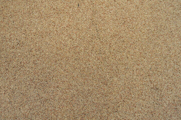 Close up of coarse beige and pink pebble dash finish